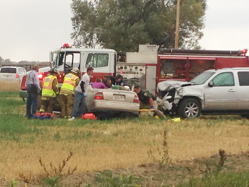 Emergency responders, including Worden Volunteer Fire Department personnel, Montana Highway Patrol Trooper Kirk Robbins, and a Yellowstone County sheriff