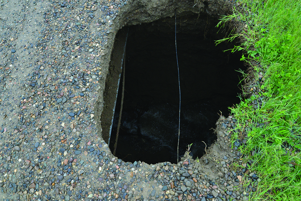 A sinkhole that developed along Pinto Drive off Clark Road in the Shepherd area has been repaired. (Jonathan McNiven photo)