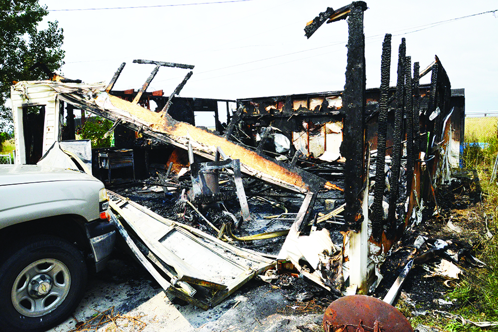 Lighting is suspected in the fire that destroyed this garage on Tigard Avenue in Lockwood Tuesday night. (Jonathan McNiven photo)