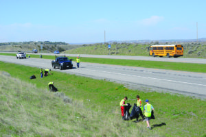 Volunteers picking up trash along Interstate 94 on Saturday, April 28, 2018. (Jonathan McNiven Photo)