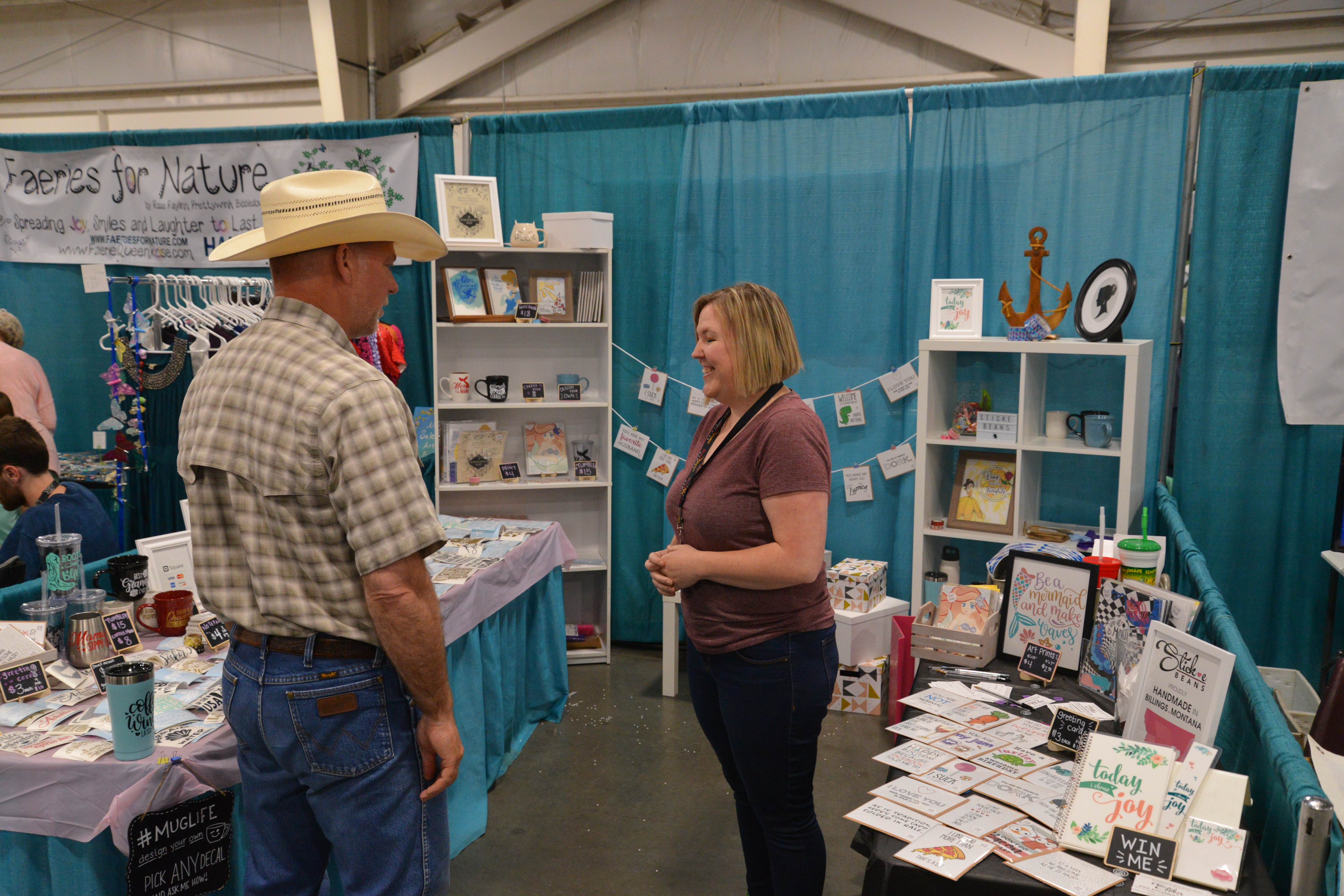 Small business owner Anna Meeks, right, visits with Montana US Congressman Greg Gianforte about her business while he visited MontanaFair on Monday August 13, 2018. (Photo by Jonathan McNiven)