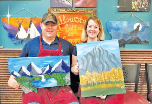 Jonathan and Tana McNiven try their hand at painting at Yellowstone Coffee and Canvas, located in Lockwood, MT.