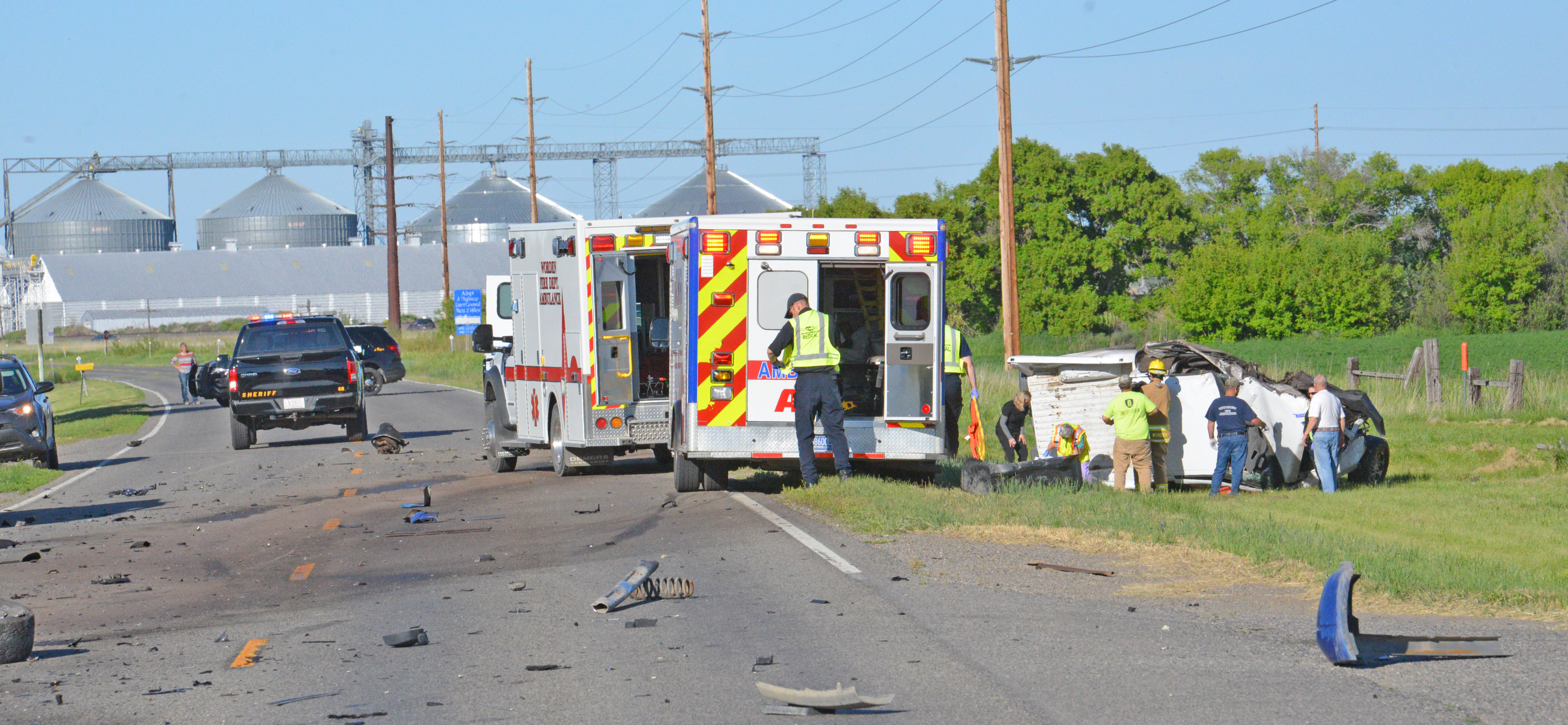 Emergency response personnel attend to a trapped victim here in this vehicle Wednesday evening along Highway 312 and Jute street in Huntley. (Jonathan McNiven Photo)