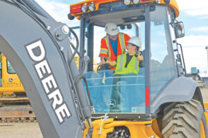Cole McNiven enjoys an operations tutorial with RDO Manager John Hurd as teams prepare for DigIt Days, 2019. (Courtesy photo)