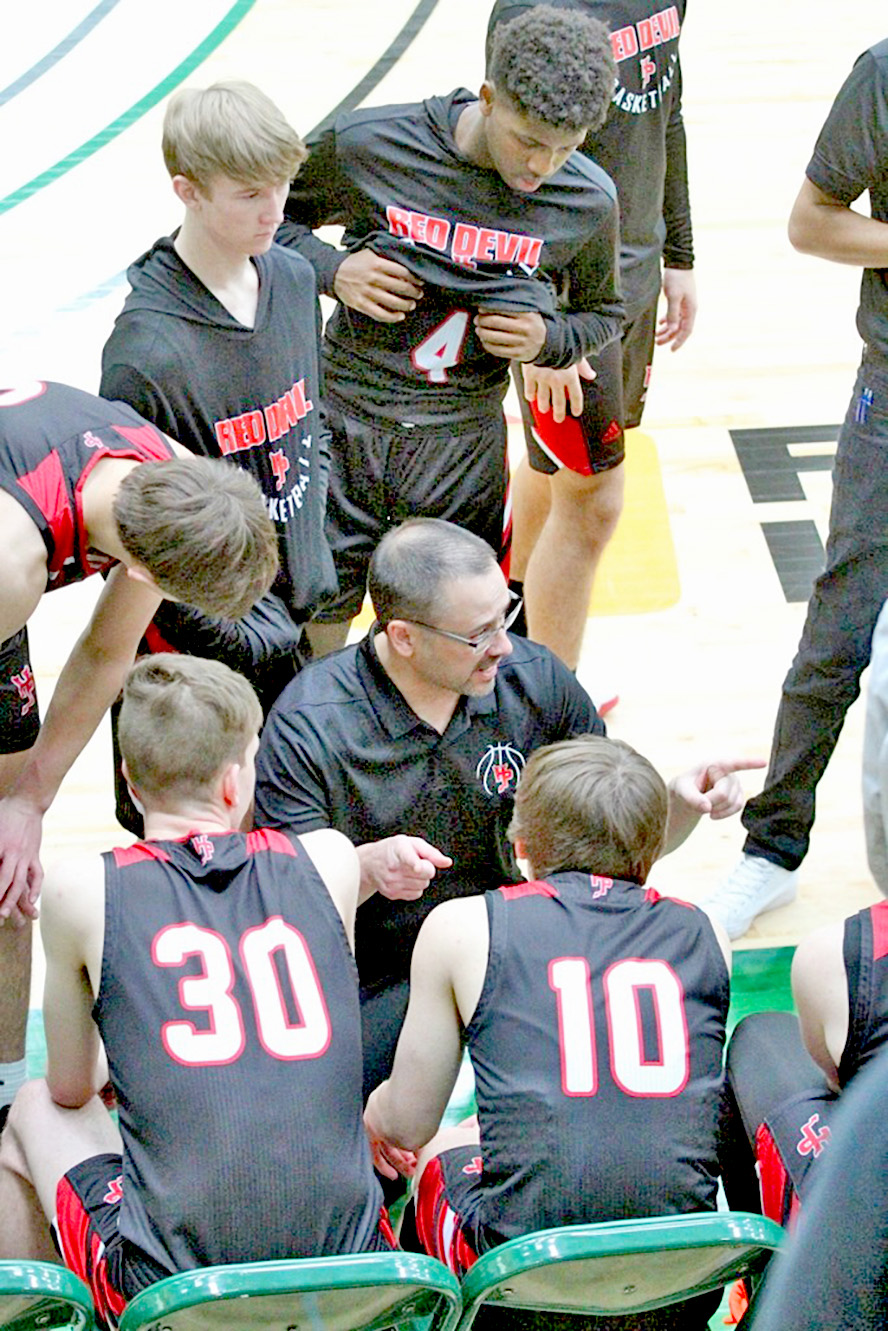 Huntley Project Head Coach, Randy Robinson directing playersat the Divisional Basketball tournament. photo -Lori Durst Ellis