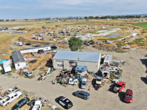 Carbon County Sheriff's Office, assisted by Yellowstone County deputies, seize more stolen items hebind this property along Shepherd Acton Road, (drone image by Jonathan McNiven)