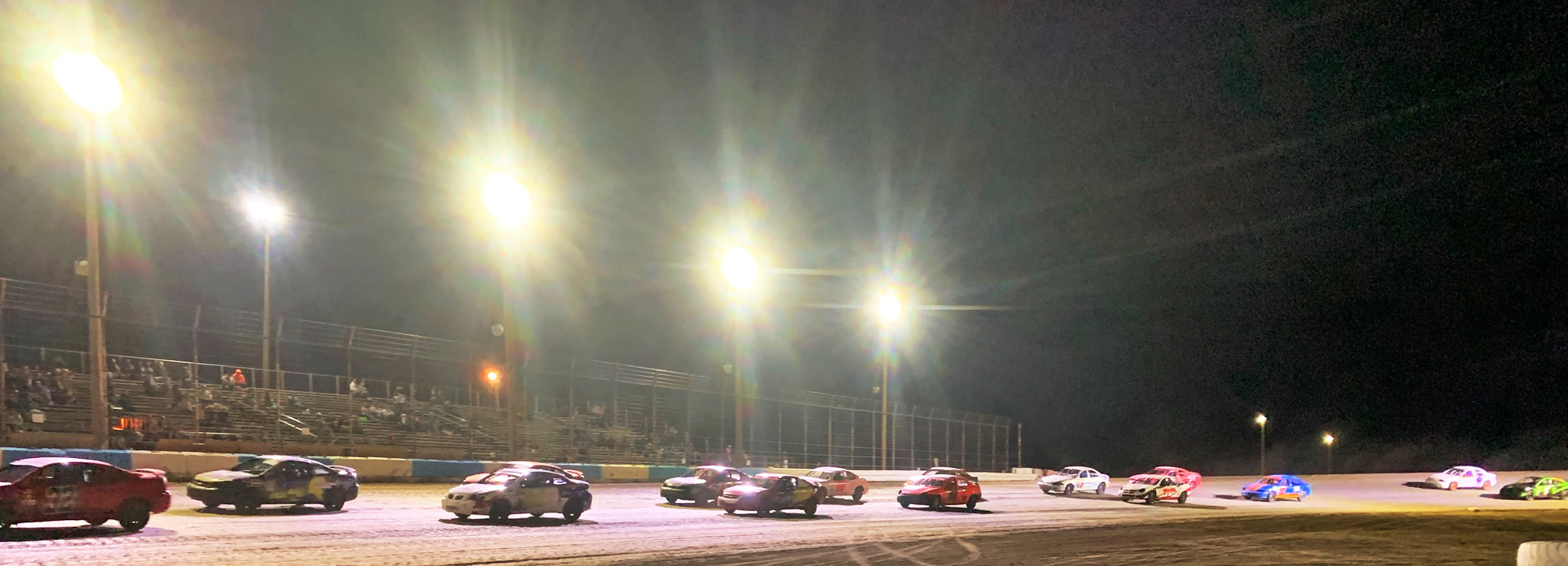Here, compact sports cars line up to race in the finals at Big Sky Speedway Saturday July 20 2024. , Chas Matye was the feature winner of the IMCA Sport Compact race. (Jonathan McNiven Photo)